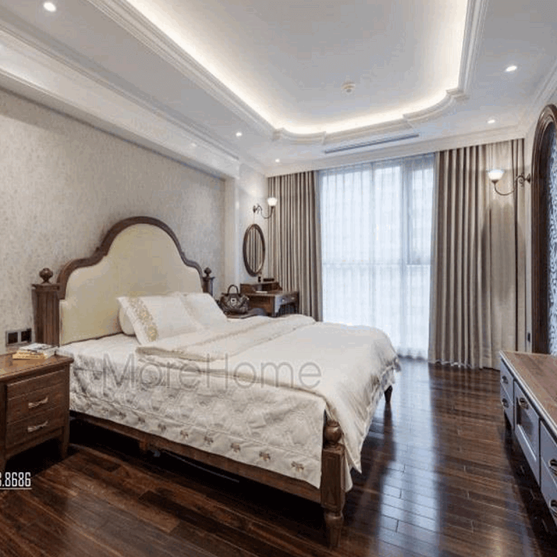 Mẫu giường ngủ gỗ óc chó với thiết kế đầu giường cách điệu bọc da màu trắng mang đến vẻ đẹp sang trọng cho không gian căn phòng của gia chủ.
